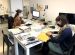 Image of Artexte Librarians Hélène Brousseau and Jessica Hébert at work.