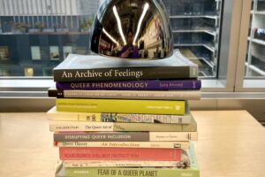Collection of books from Hanss Lujan Torres' research on the development of queerness in contemporary art.