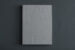 Black and white photograph of a large grey book, with "SANDRA BREWSTER. BLUR." embossed on the cover page.